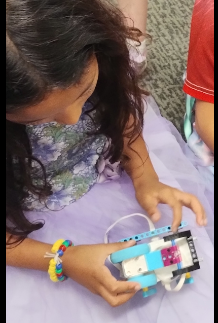 Student building a LEGO robot