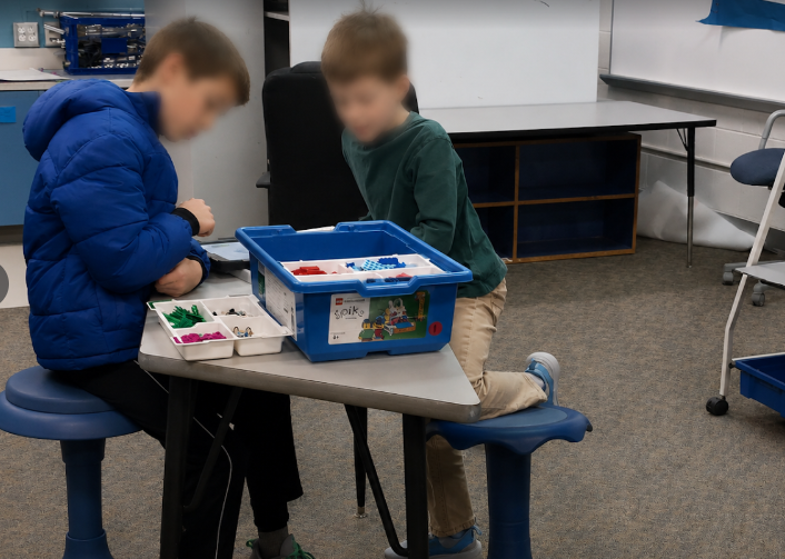 Students working with LEGO robotics kits
